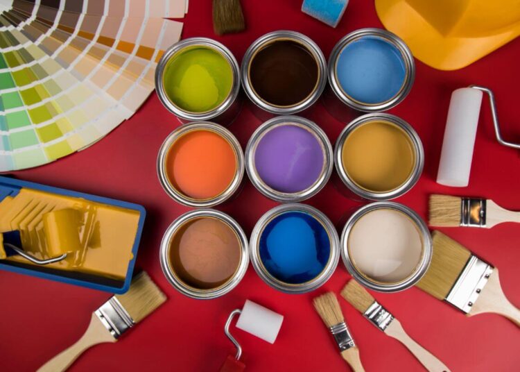 An image showing paint can and brushes