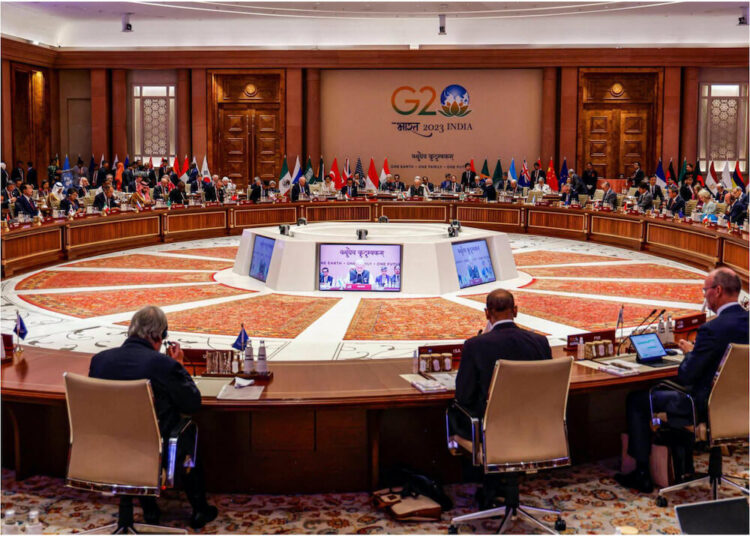 An image showing the world leaders sitting in conference for G20